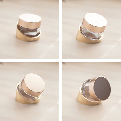 Tilt ink pot holder set with gold base, clear cup, and white lid in multiple angles