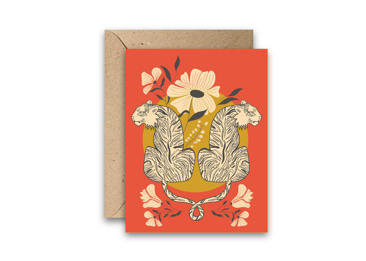 Greeting card with entwined tigers, flowers, and a kraft envelope