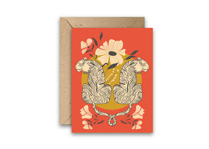 Greeting card with entwined tigers, flowers, and a kraft envelope