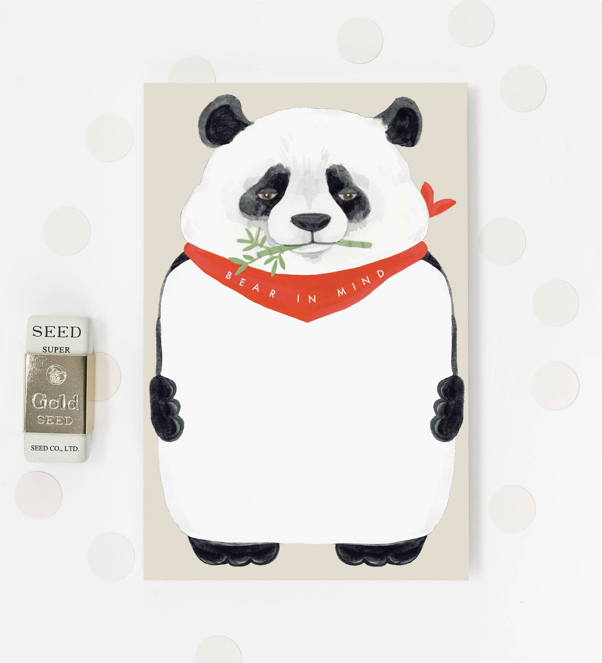 Panda bear notepad with white cover and red “BEAR IN MIND” ribbon design