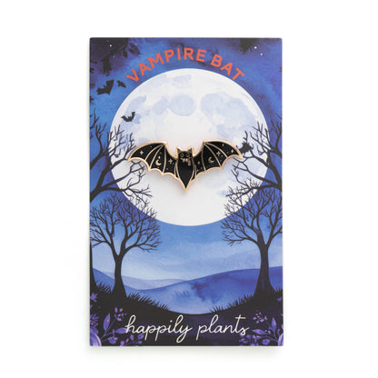 Vampire bat gift card with moonlit forest scene and a bat pin illustration