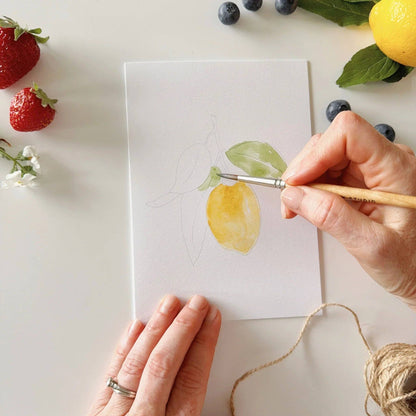 Paintable watercolor notecard with yellow and green fruit wash; hand painting.