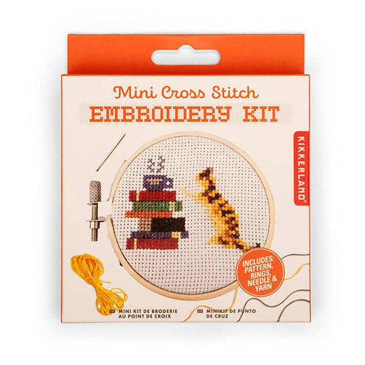 Mini cross stitch embroidery kit with cat design, hoop, and yarn colors in box
