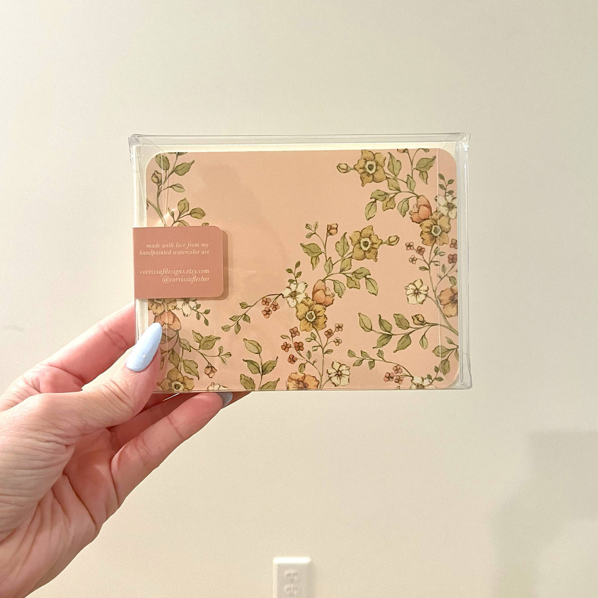 Clear sleeve stationery set with floral envelope and butterfly stamp, includes insert card.