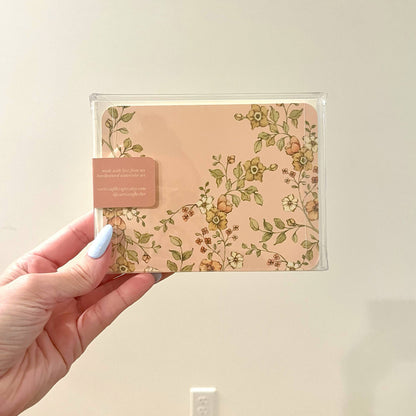 Clear sleeve stationery set with floral envelope and butterfly stamp, includes insert card.