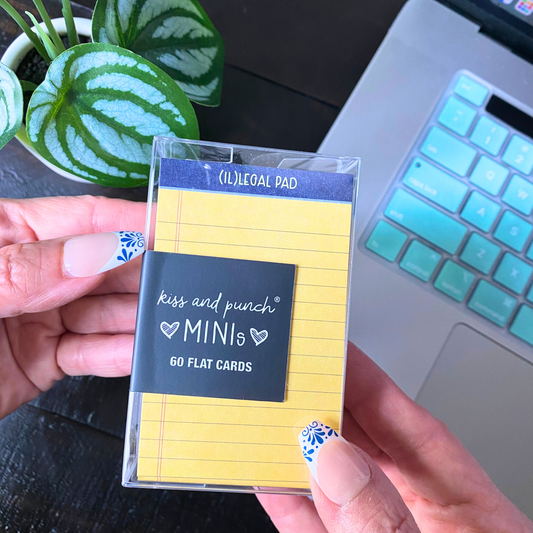 Mini notecard set in clear sleeve, yellow lined cards with “kiss and punch” design