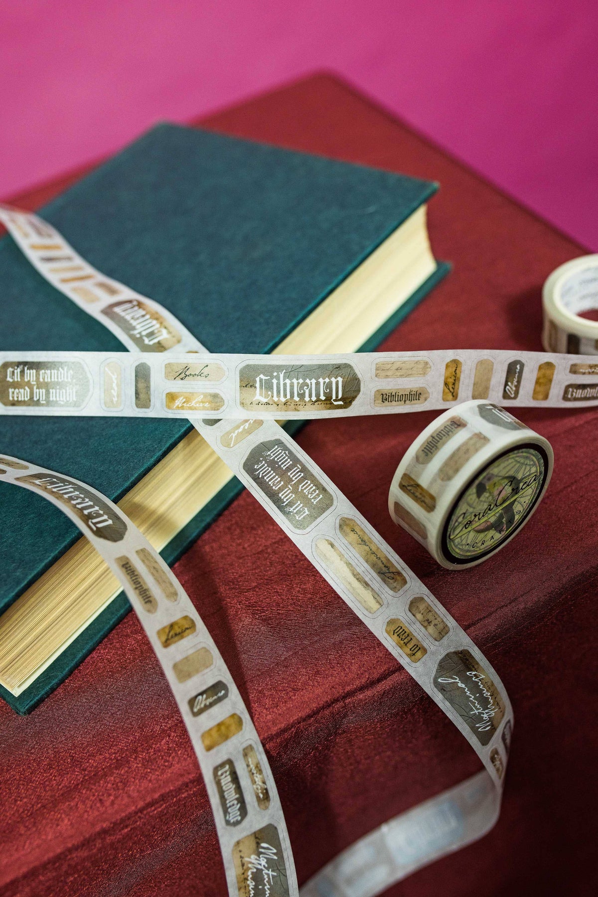 Peel-off label roll with layered strips and gold-bordered text labels