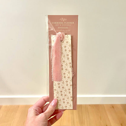 Ditsy floral bookmark with pink velvet ribbon, shown on backing card