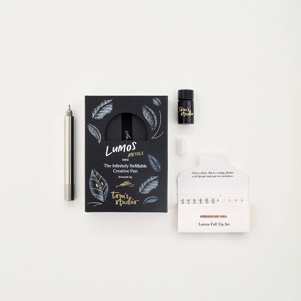 Stainless steel fountain pen kit with pen, ink bottle, and product card and tip holder