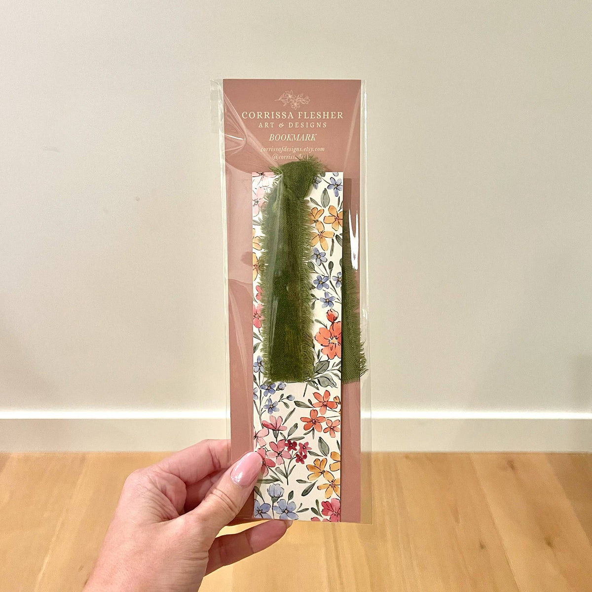 Packaged floral double-sided bookmark with multicolor flowers and green velvet ribbon loop