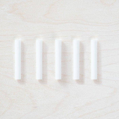 Five white spare ink reservoir tubes