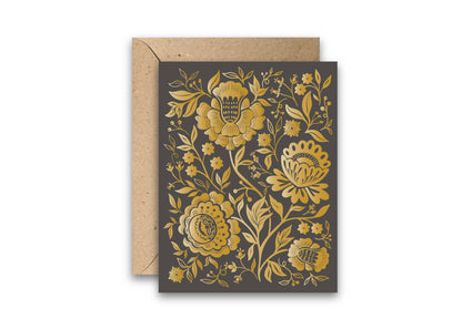 Indian floral greeting card with gold foil blooms on a dark cover and a kraft envelope