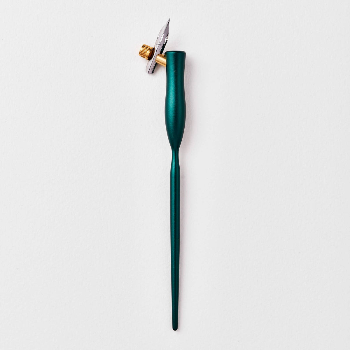 Teal flourish calligraphy pen with angled nib and gold accent ring