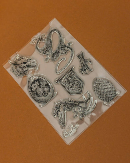 Clear stamp set sheet with dragon, turtle, and horned creature motifs