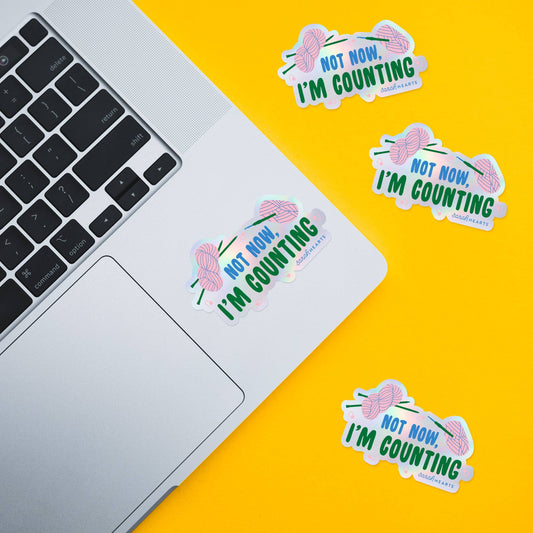 Set of holographic stickers: “Not Now, I’m Counting” text in blue and green