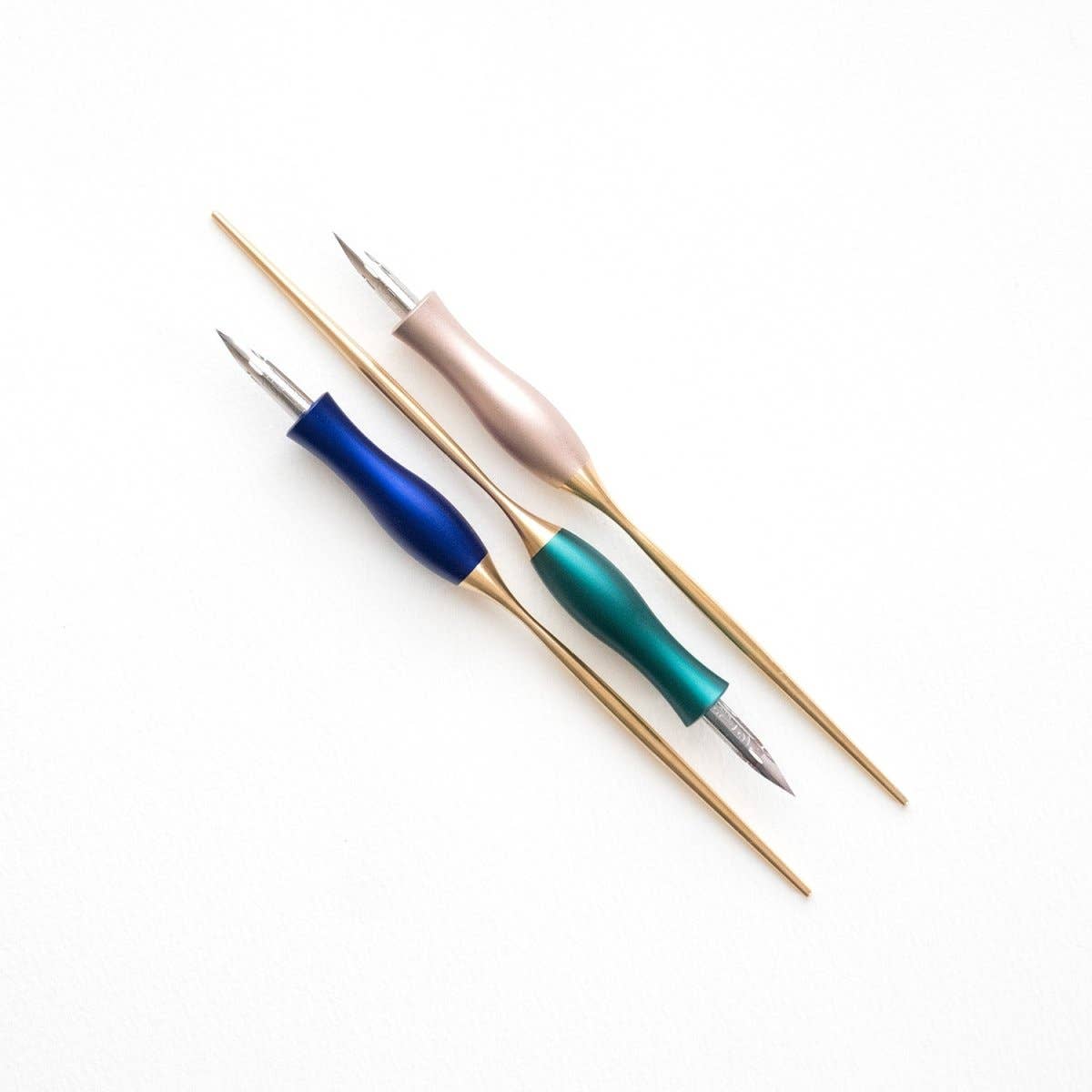 Calligraphy pen set with oblique nibs and blue, green, and pink handles