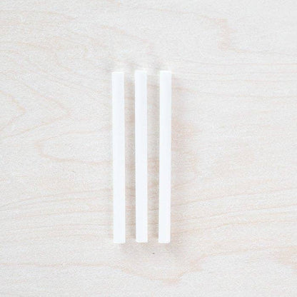 Three white spare ink reservoir tubes