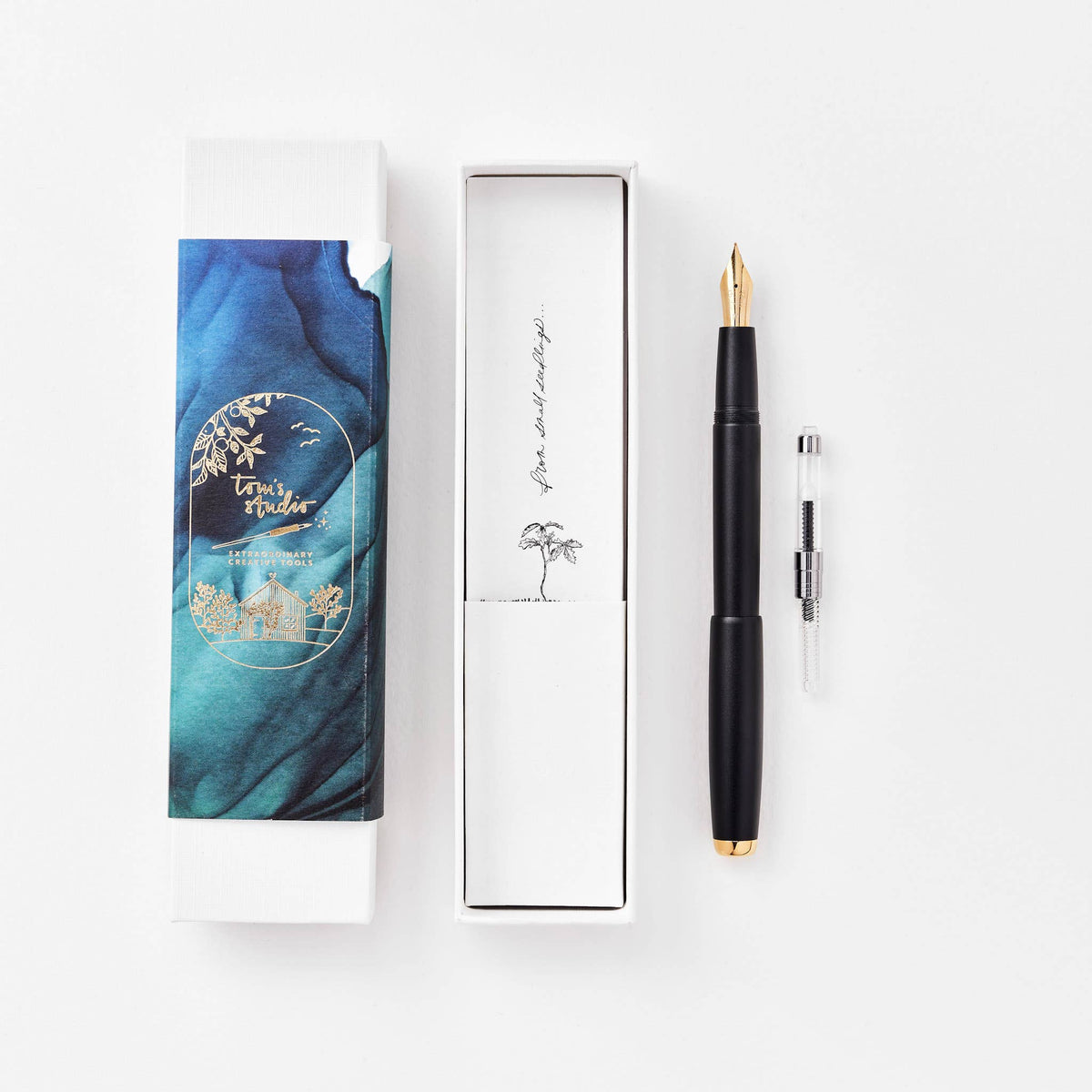 Black fountain pen in gift box with spare nib cartridge.