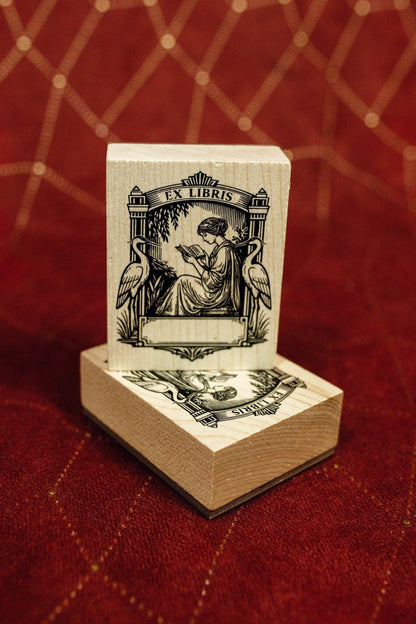 Wooden Ex Libris art deco stamp standing on a base block