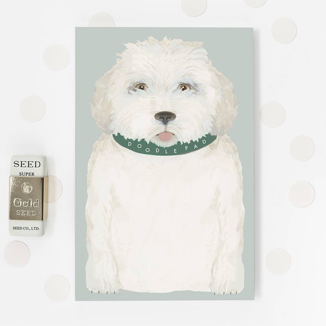 Dog-illustrated notepad with white dog cover and green "DOODLE PAW" band
