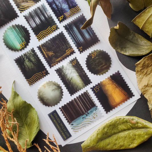 Close-up of forest and landscape stamp stickers with scalloped edges