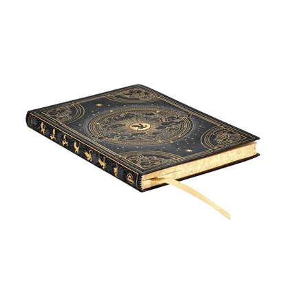 Softcover journal lying open, dark navy gold star map cover and bookmark ribbon