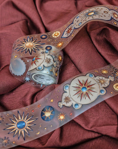 Astronomy transparent tape strip with moons, sunburst stars, and celestial decals