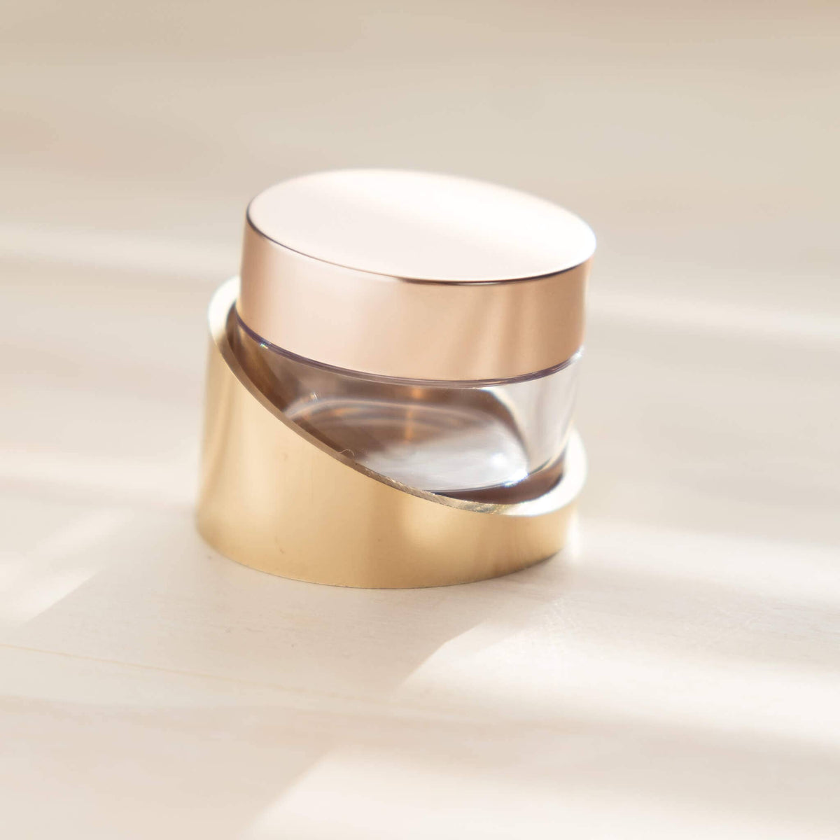 Tilt ink pot holder with gold base, clear glass insert, and white lid closed