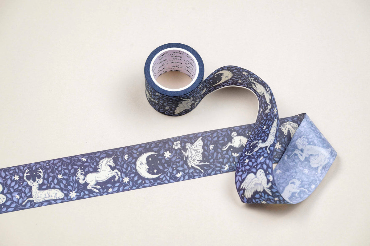 Washi tape roll with blue unicorn and moon pattern, loose decorative strip