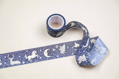 Washi tape roll with blue unicorn and moon pattern, loose decorative strip