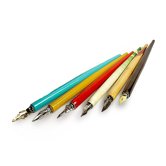 Set of colorful calligraphy dip pens with pointed metal nibs, fanned out for view