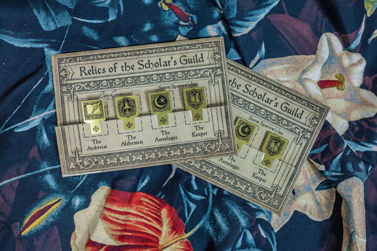 Two ornate rectangular page marker cards with emblems and labeled sections