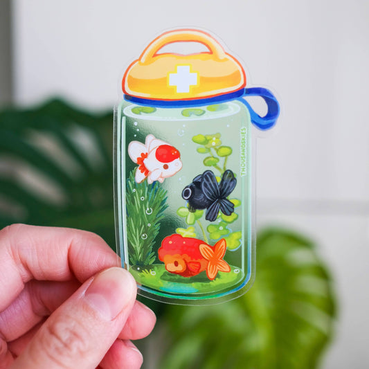 Transparent vinyl sticker shaped like a goldfish jar with orange lid and fish graphics