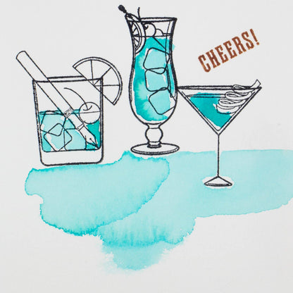 Clear stamp set featuring cocktail glass and Cheers! stamps on paper