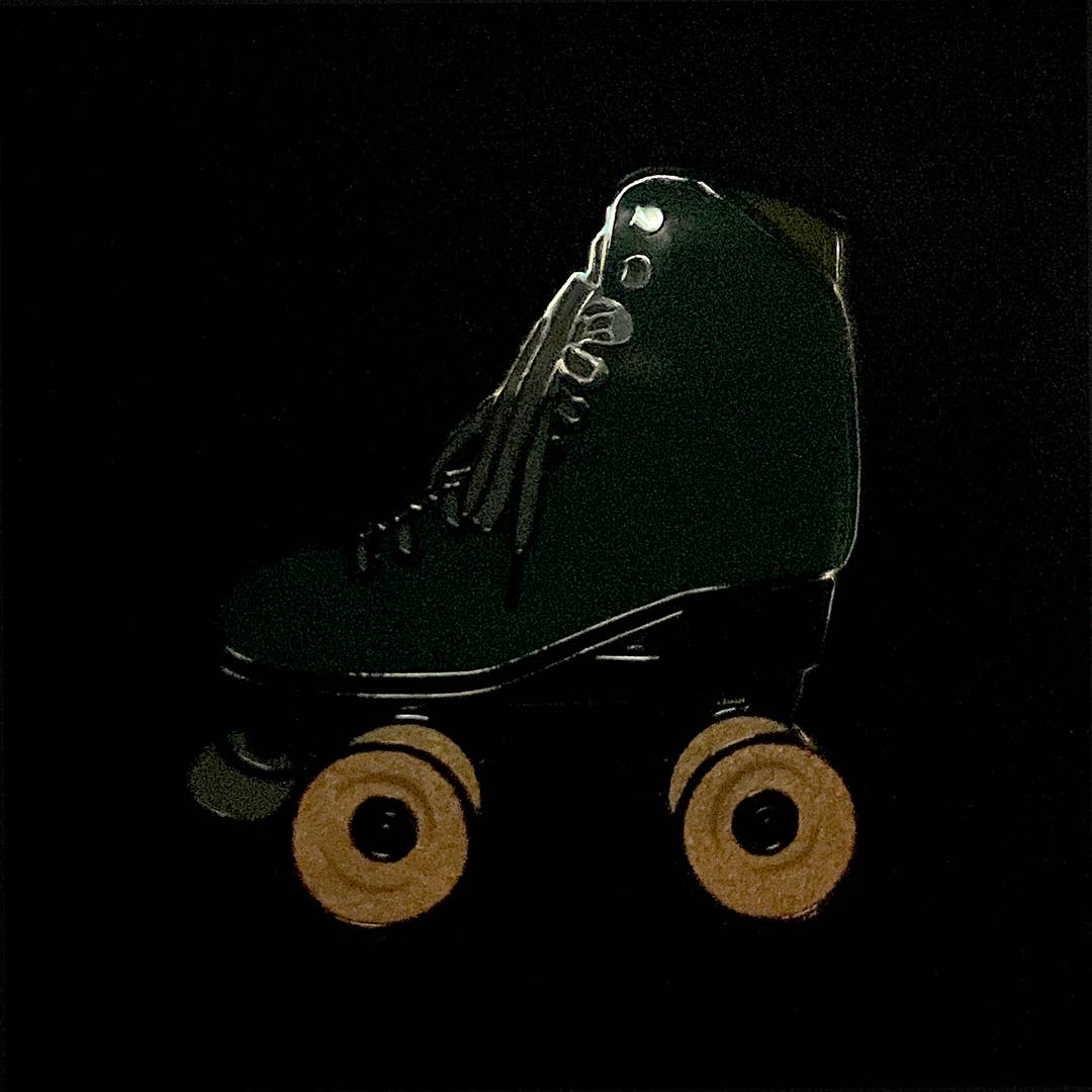 Sea Foam roller skate pin with glow in the dark wheels