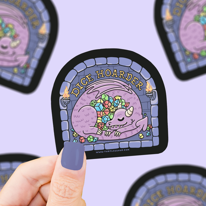 Cute dice-hoarder dragon vinyl sticker, arched frame with colorful dice artwork