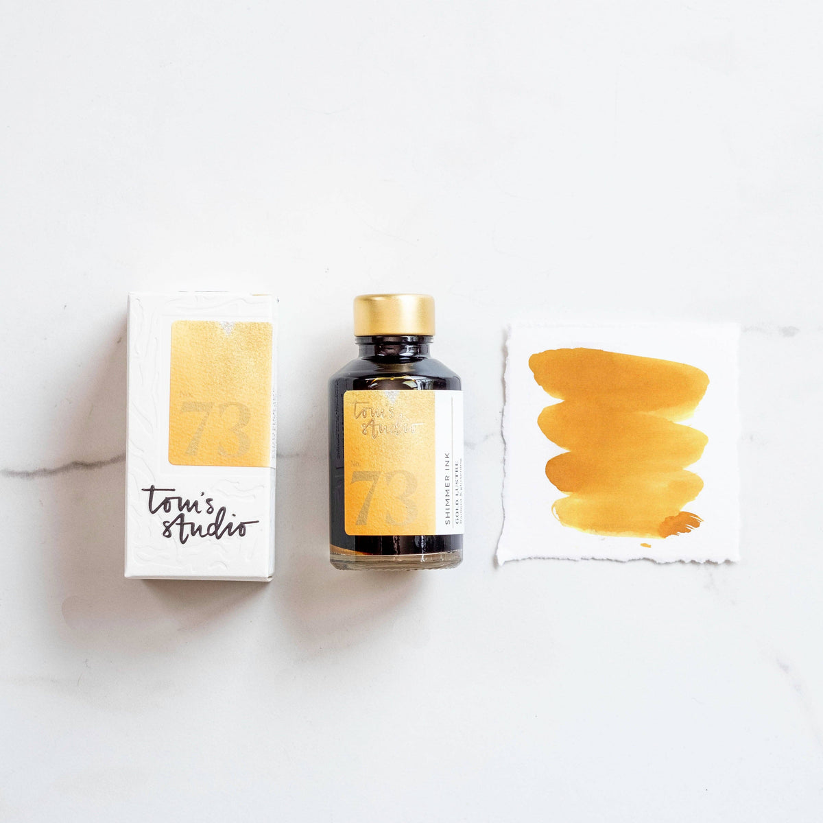 Gold shimmer ink bottle with matching ink swatch cards, Golden Lustre