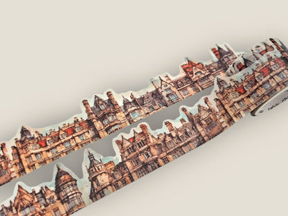 Decorative cutout tape featuring a detailed city skyline with house-shaped cutouts