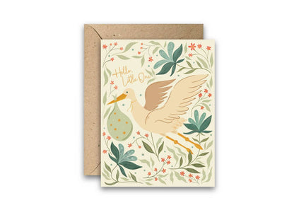 New baby greeting card with a stork carrying a baby bundle and a floral design