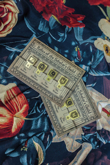 Ornate rectangular page marker cards with illustrated headings and emblem icons