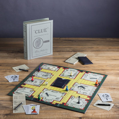 Clue board game set on table with game board, box, cards, and playing pieces