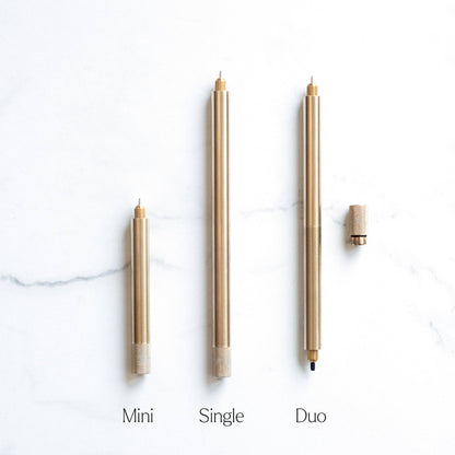 Three brass metal single-tip pens with pointed nibs