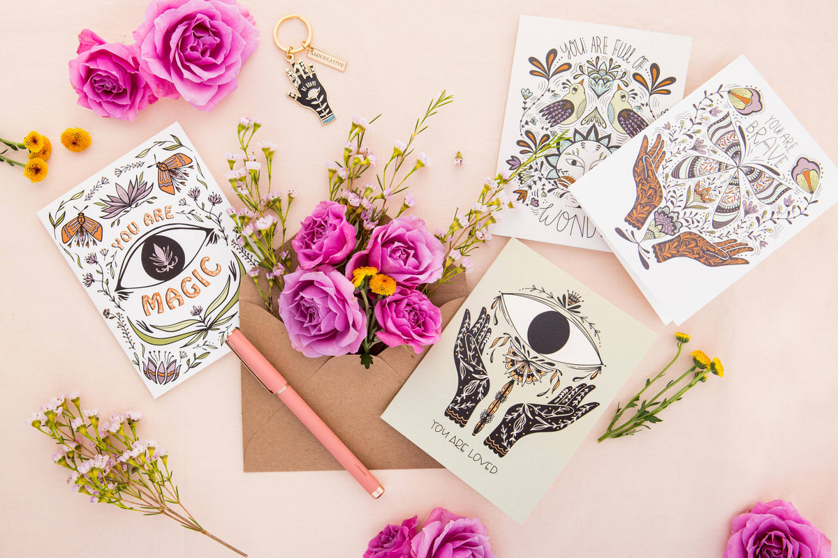 Mystical encouragement card with butterfly artwork among other illustrated cards.