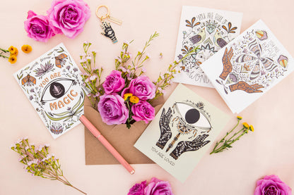 Mystical encouragement card with butterfly artwork among other illustrated cards.