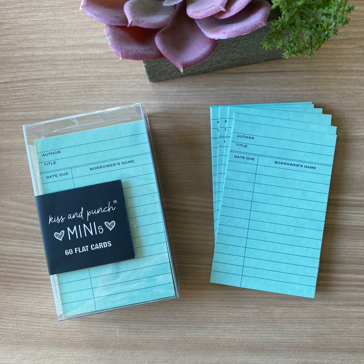Set of blue library card mini notecards with ruled lines in a clear storage box
