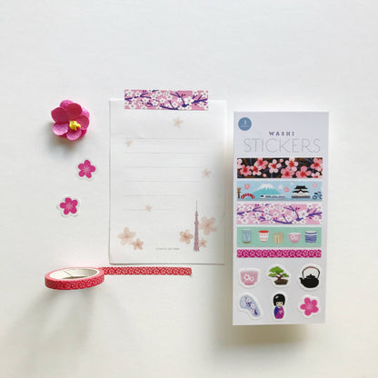 Pink cherry blossom washi tape strip roll with decorative floral border pattern