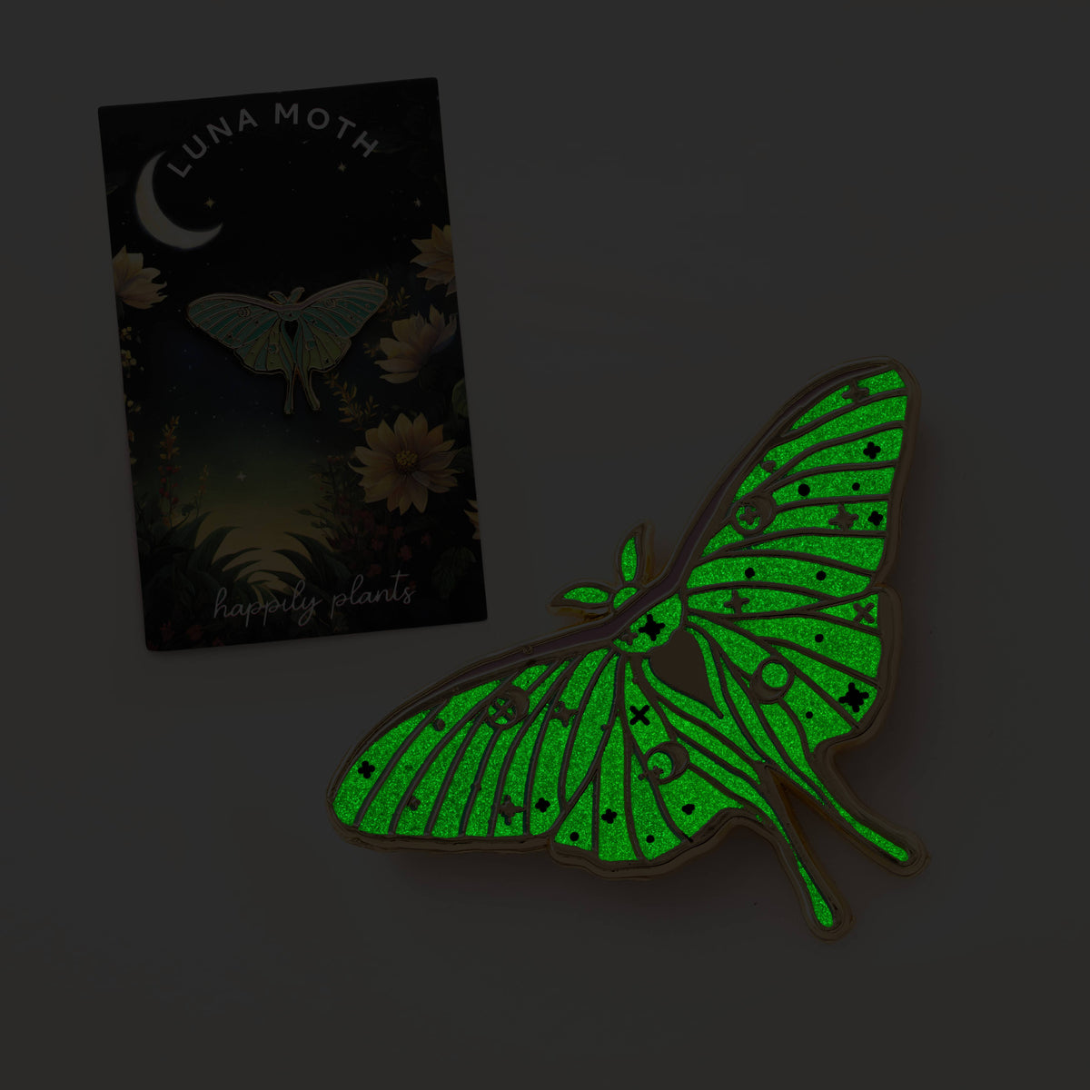 Glow-in-the-dark luna moth pin, neon green wings with gold outline