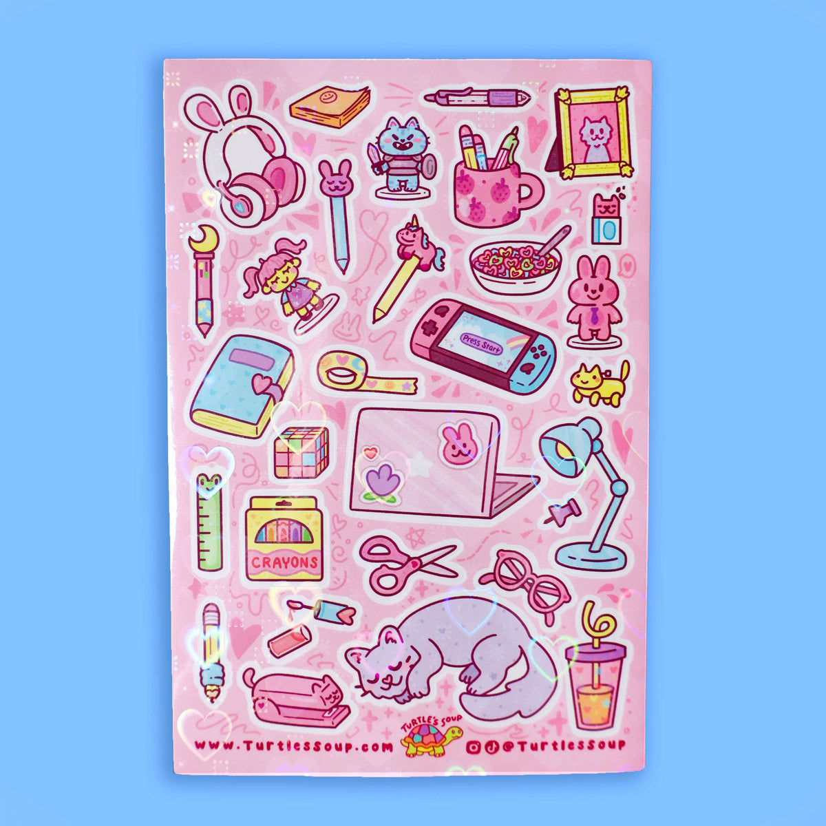 Pink glitter sticker sheet with stationery icons, bunnies, tools, and curled cat graphic