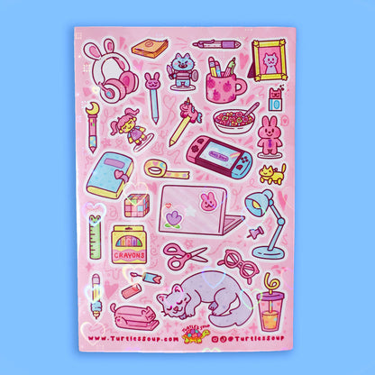 Pink glitter sticker sheet with stationery icons, bunnies, tools, and curled cat graphic