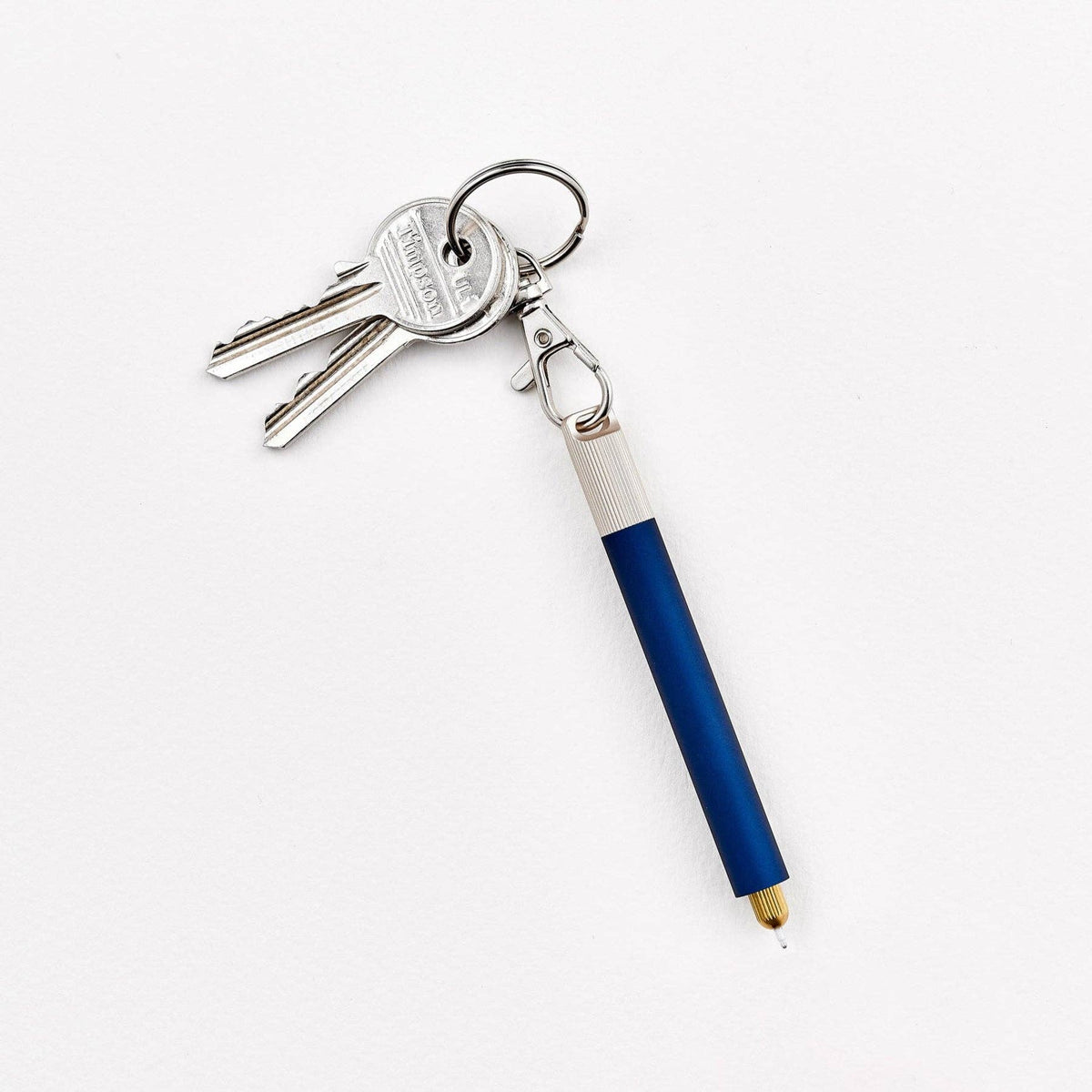Blue keychain pen with metal keyring and attached keys